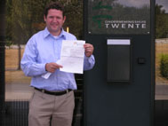 Interdependent Thoughts owner poses with proof of ownership