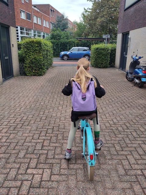 Y on her bike to go to school